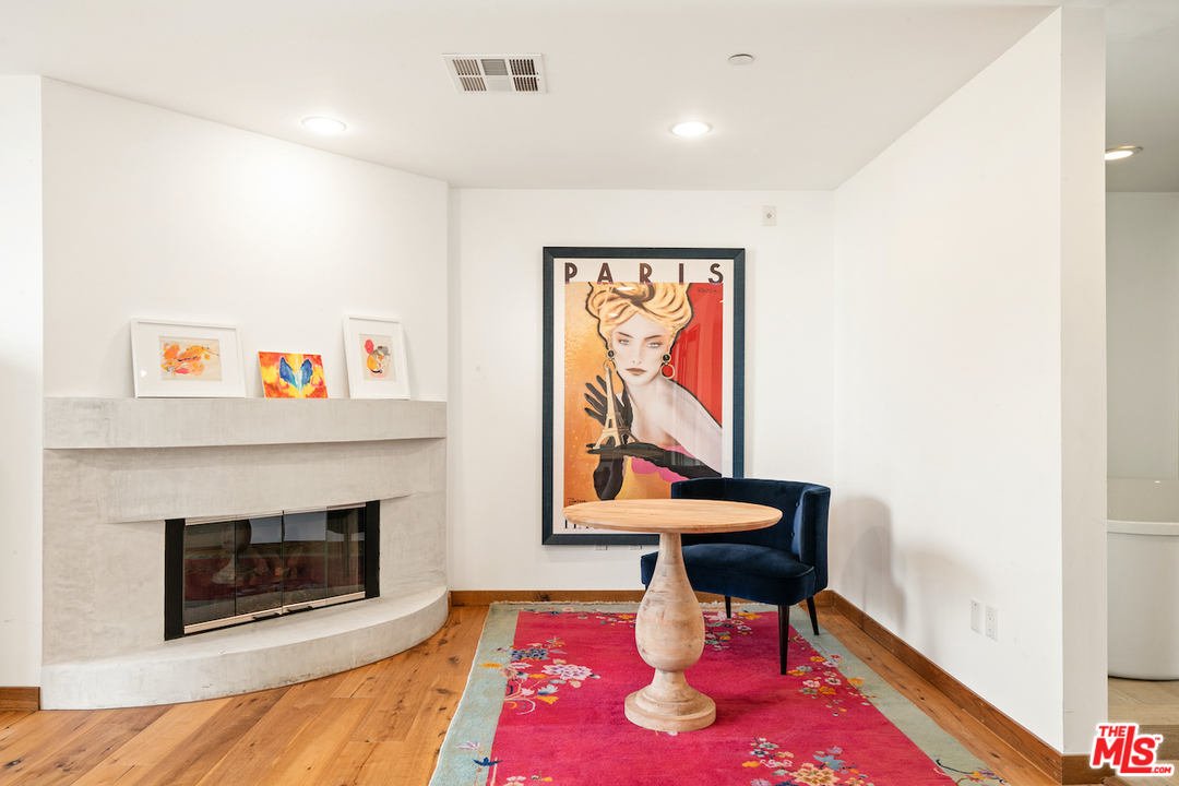 512 Brooks Avenue, Unit 4 Venice, CA 90291 - Photo 15 of 25 a living room with furniture a flat screen tv and a fireplace