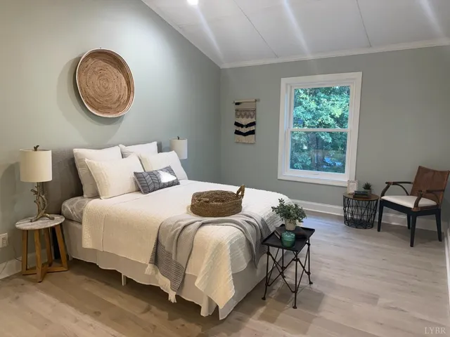 a bedroom with a bed and window