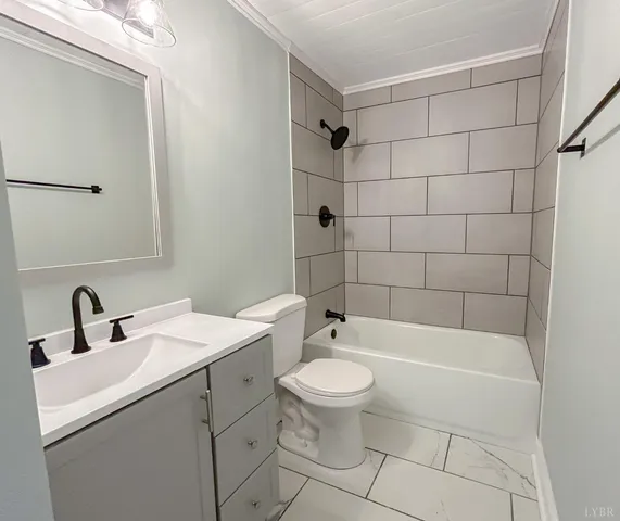 a bathroom with a toilet and bathtub