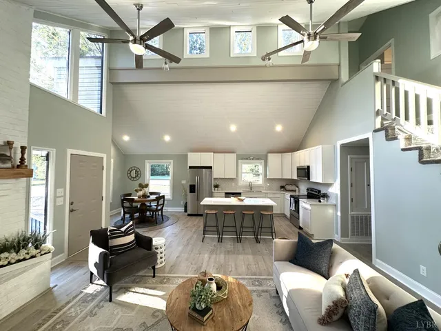 a living room with furniture and a fireplace