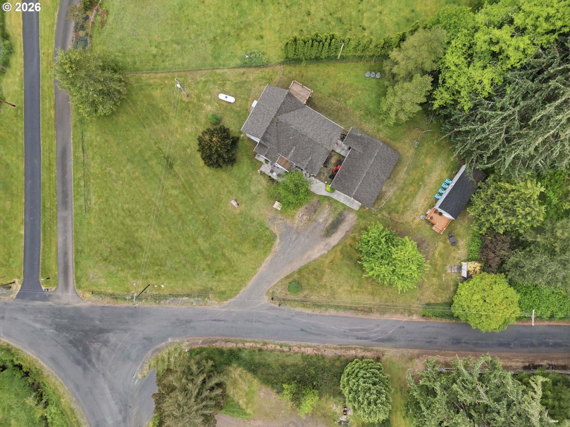 92085 Akerstedt Road Astoria, OR 97103 - Photo 43 of 48 an aerial view of a house with a yard and lake view
