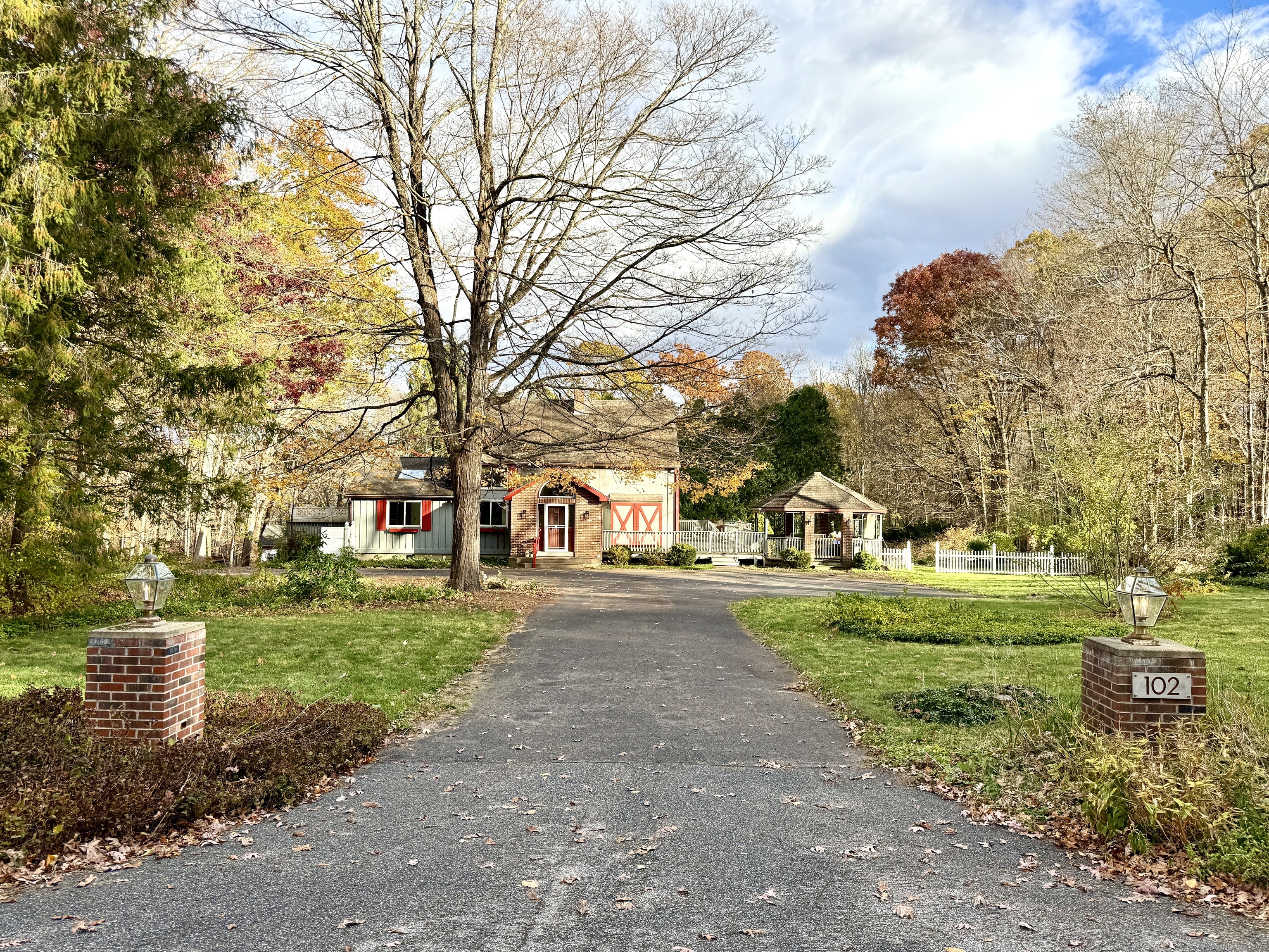 102 Krapf Road Ashford, CT 06278 - Photo 39 of 39 a front view of a house with a garden and tree
