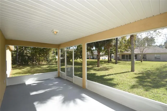 a view of a porch and garden