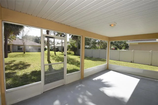 a view of an empty room with glass windows