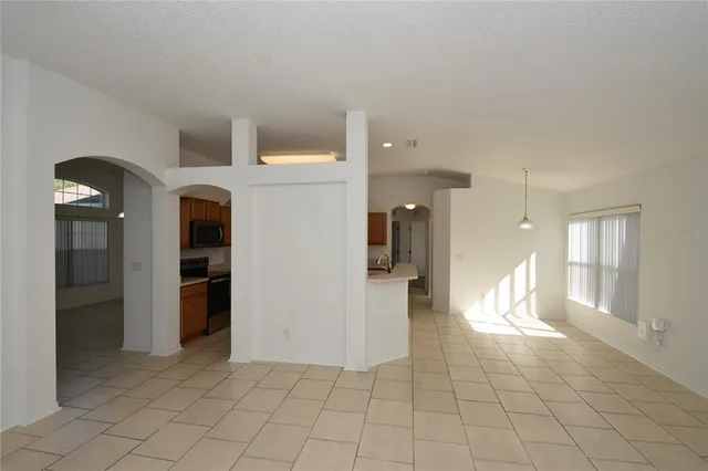 a kitchen with stainless steel appliances a stove a sink and a microwave