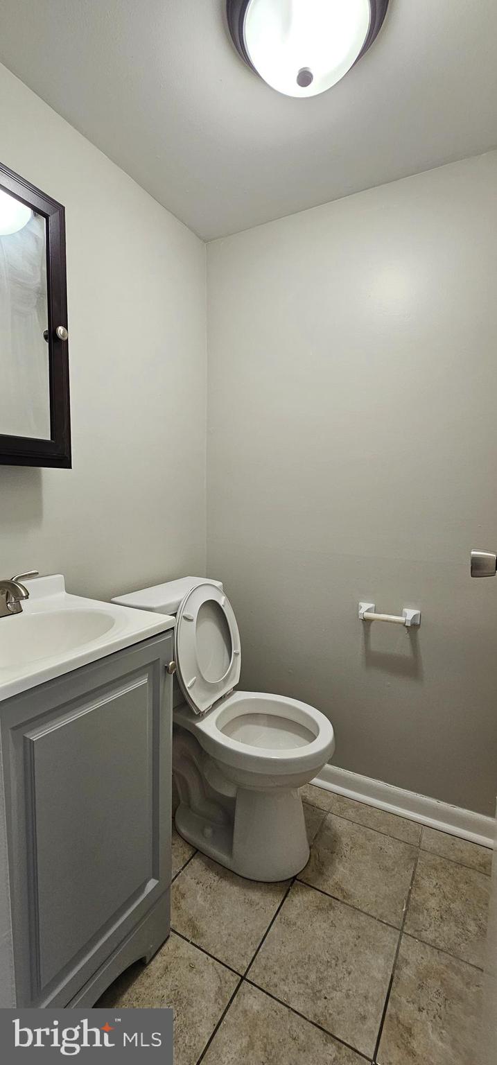 501 Germantown Court Warminster, PA 18974 - Photo 7 of 12 a bathroom with a toilet sink and mirror