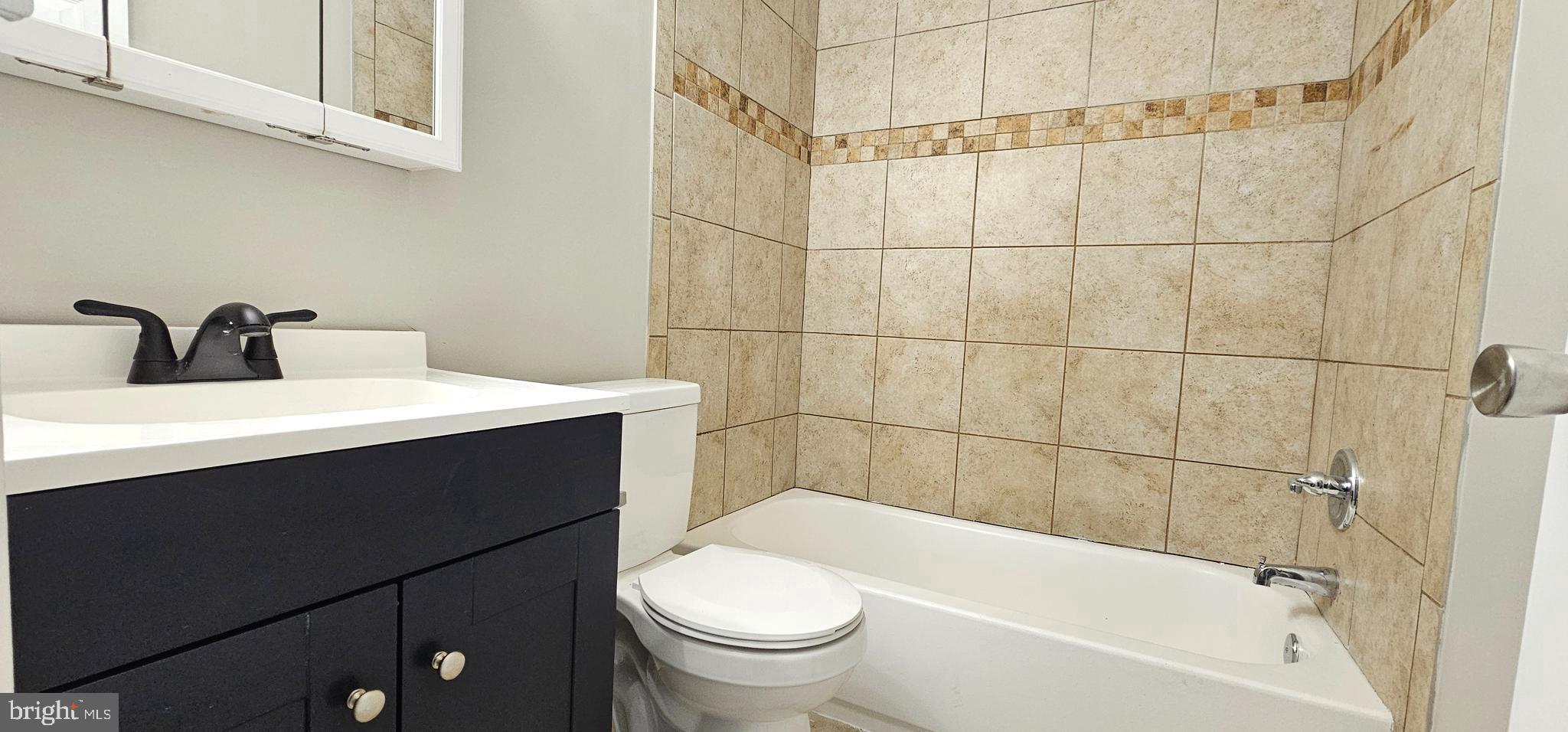 501 Germantown Court Warminster, PA 18974 - Photo 8 of 12 a bathroom with a sink a toilet and shower