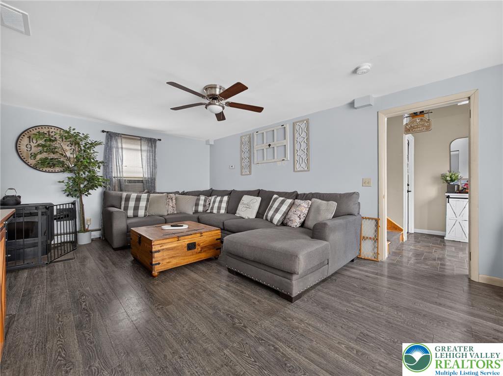 2628 Levans Road Coplay, PA 18037 - Photo 13 of 54 A comfortable living space boasts durable laminate flooring, ideal for everyday relaxation.