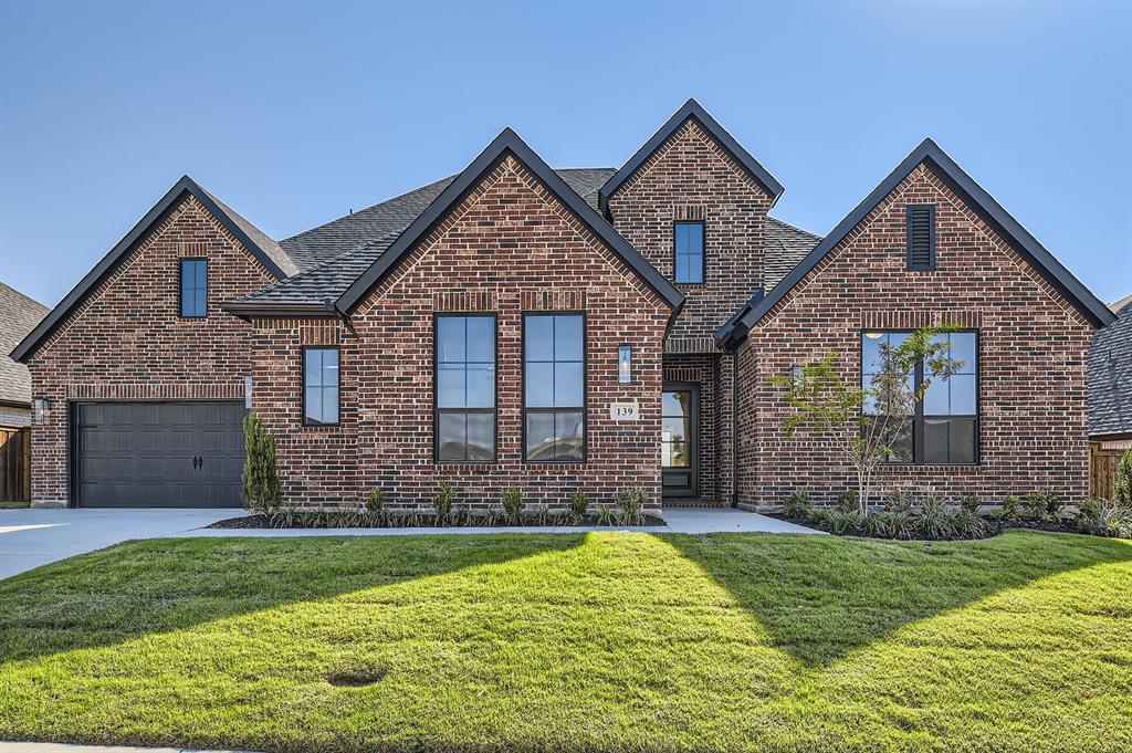 139 Shoreview Drive Rhome, TX 76078 - Photo 1 of 1 View of front of house with a front lawn and a garage