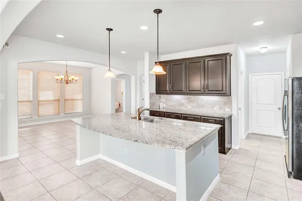 a view of wooden floor and windows in a room