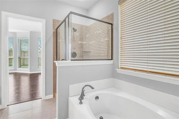 a bathroom with double vanity sink and a mirror