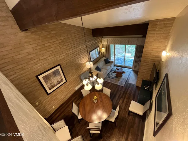 a view of a livingroom with furniture and a table