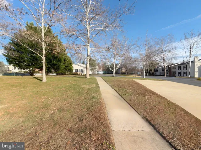 a view of a swimming pool with an outdoor space and seating area