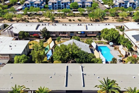 an aerial view of a houses with yard