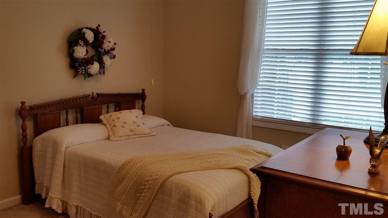 5425 Neuse Forest Road Raleigh, NC 27616 - Photo 12 of 25 a bedroom with a bed and a window