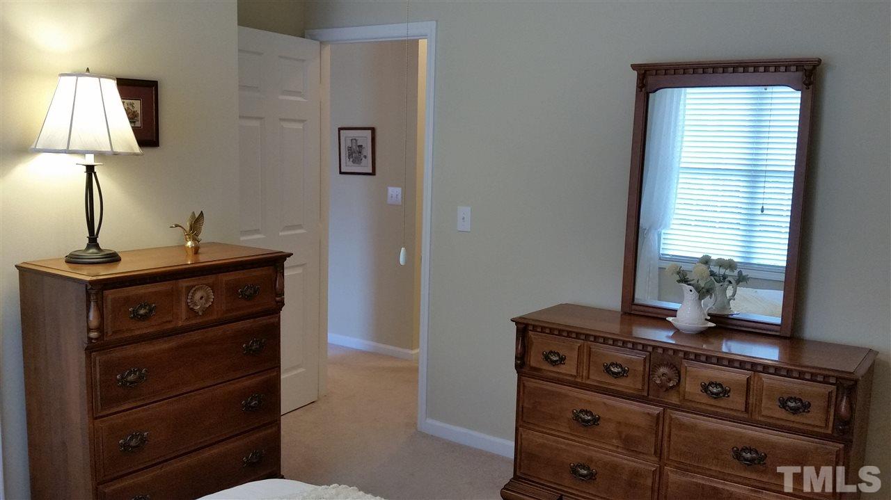 5425 Neuse Forest Road Raleigh, NC 27616 - Photo 13 of 25 a room with a dresser with a mirror