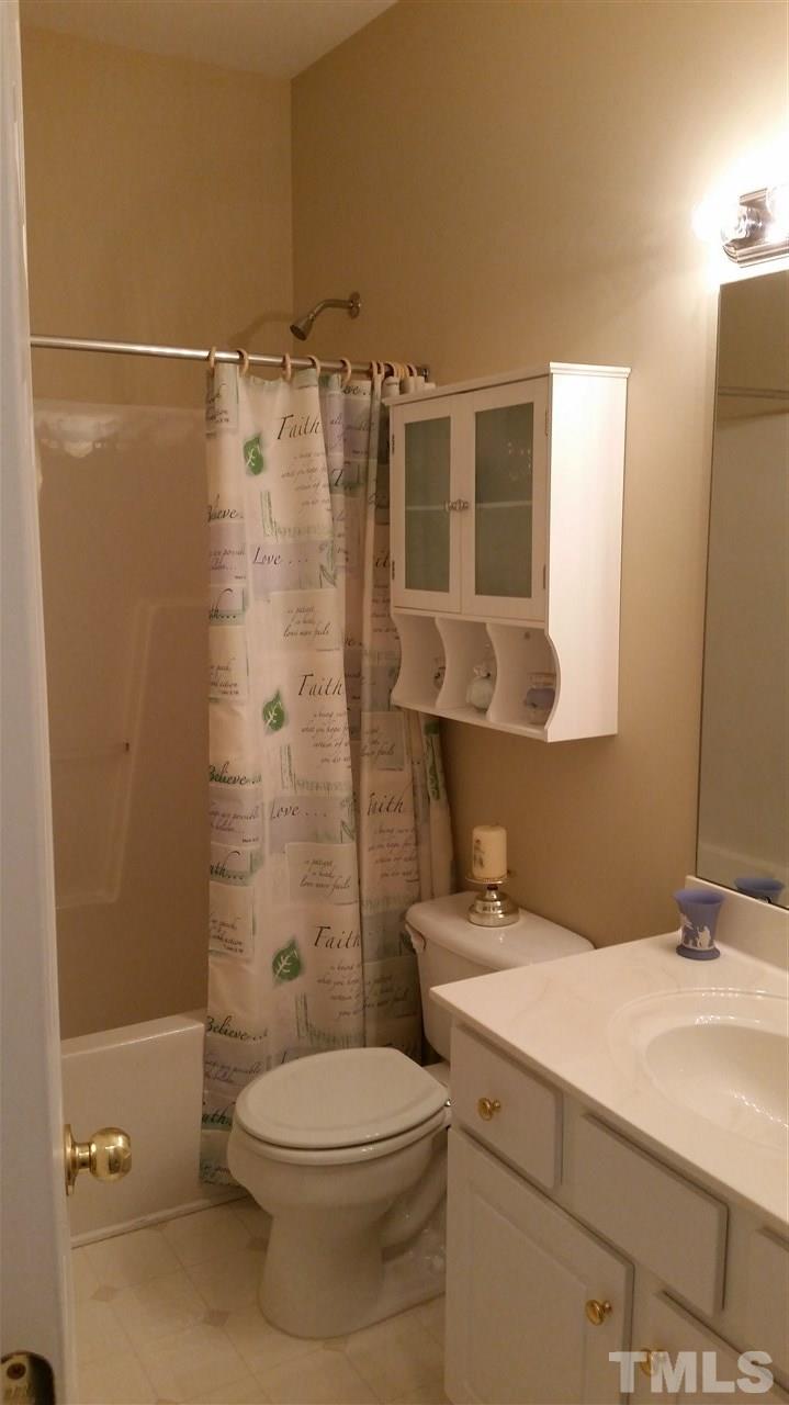 5425 Neuse Forest Road Raleigh, NC 27616 - Photo 14 of 25 a bathroom with a sink a toilet and shower