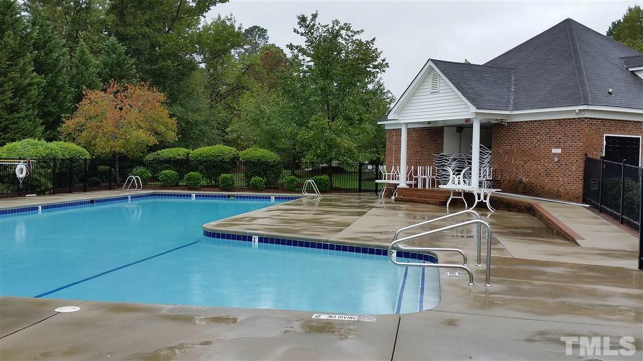 5425 Neuse Forest Road Raleigh, NC 27616 - Photo 23 of 25 a view of a patio with table and chairs under an umbrella