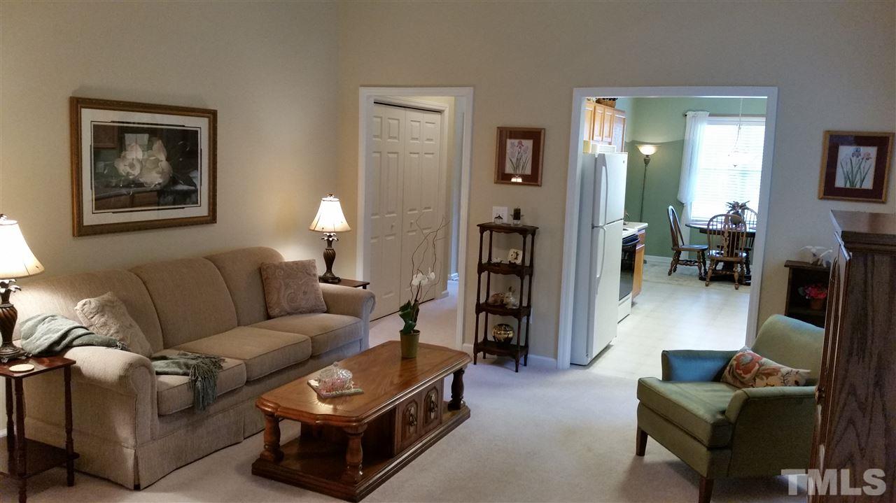 5425 Neuse Forest Road Raleigh, NC 27616 - Photo 6 of 25 a living room with furniture and a wooden floor