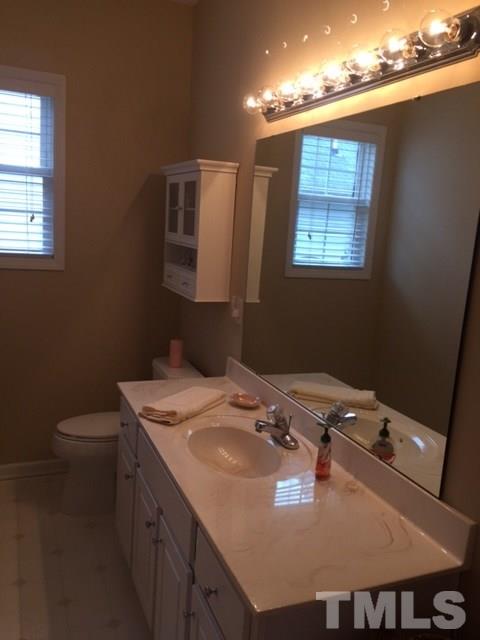 5425 Neuse Forest Road Raleigh, NC 27616 - Photo 9 of 25 a close view of a sink a table and chair in a room