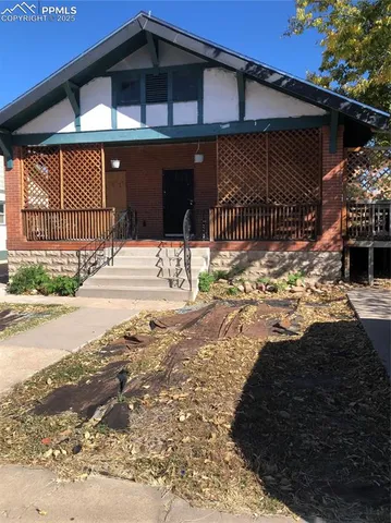 a view of a house with a snow in the yard