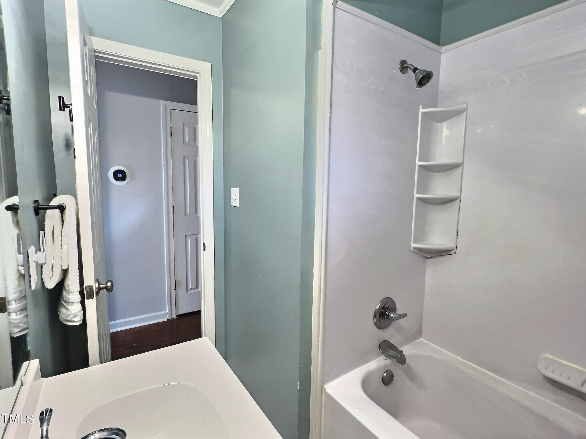 717 St George Road Raleigh, NC 27610 - Photo 19 of 32 a bathroom with a tub and sink