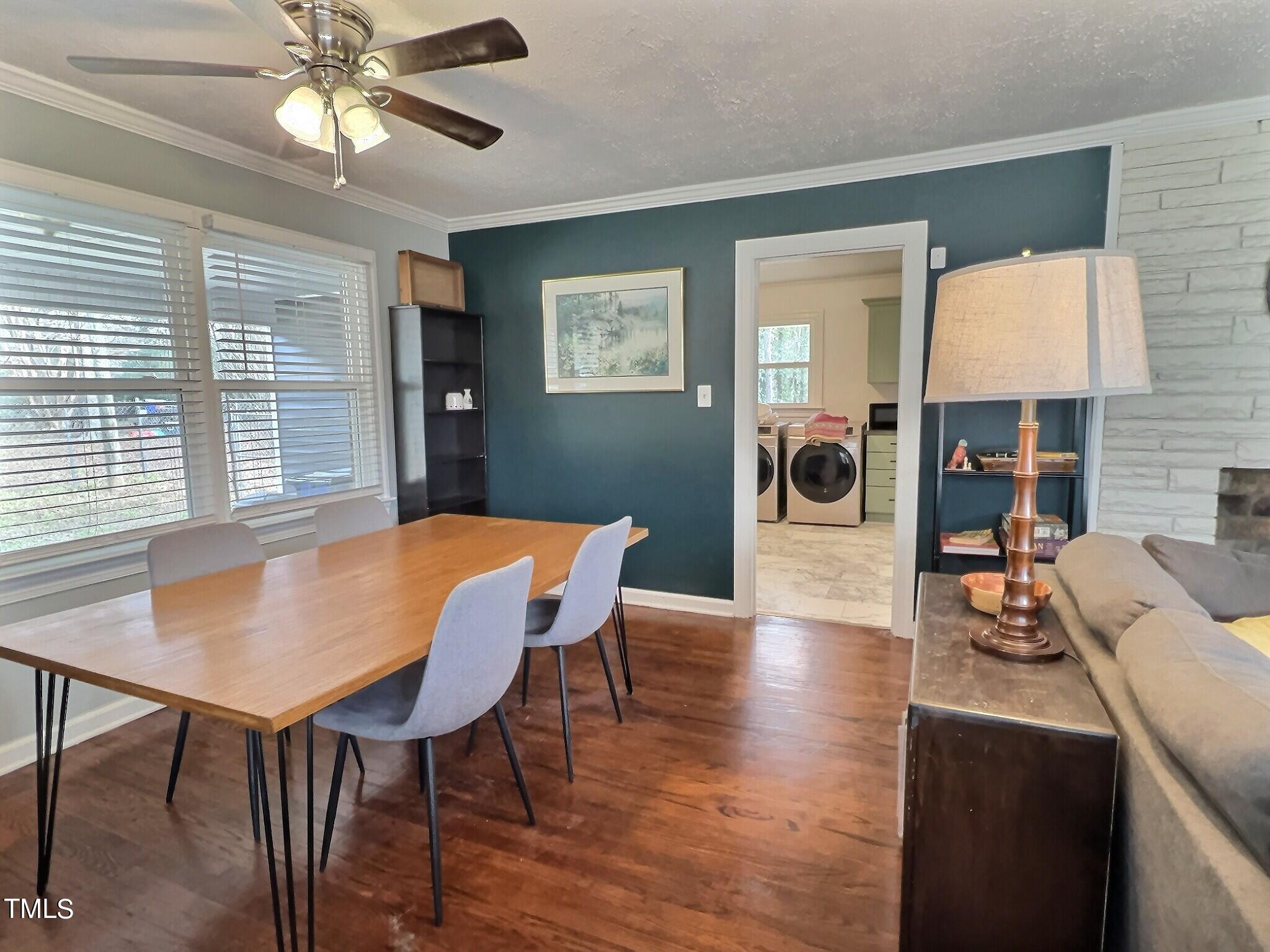 717 St George Road Raleigh, NC 27610 - Photo 7 of 32 a view of a dining room with furniture and wooden floor