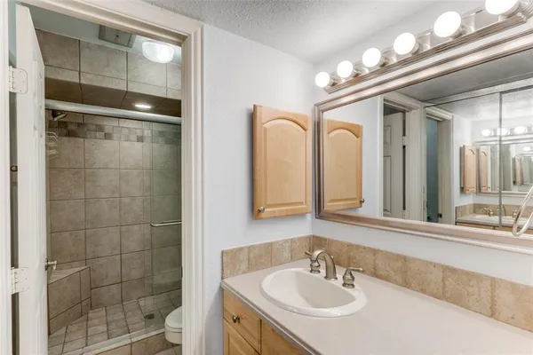a bathroom with a sink double vanity and a mirror
