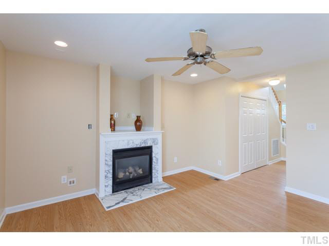 4901 Windblown Court Raleigh, NC 27616 - Photo 11 of 21 a view of an empty room with a fireplace