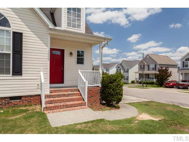 4901 Windblown Court Raleigh, NC 27616 - Photo 3 of 21 a front view of a house with a yard