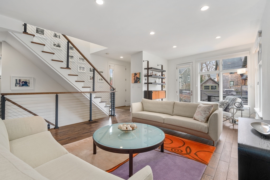 8 Coyne Road, Unit 1 Newton, MA 02468 - Photo 8 of 37 a living room with furniture and a dining table