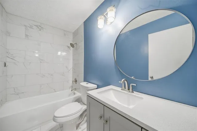 an empty room with chandelier fan