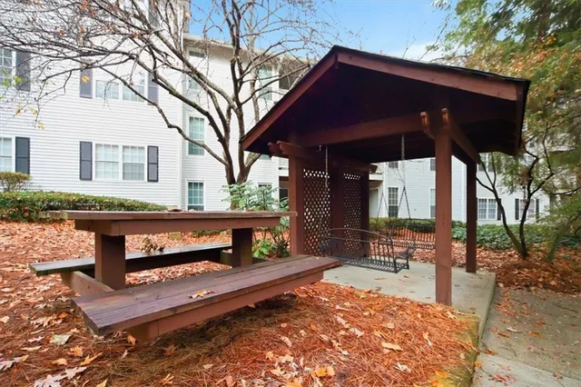 a view of a porch with wooden fence