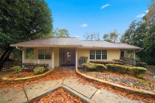 a view of walk in closet with wooden floor