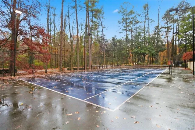 a view of a swimming pool with outdoor seating