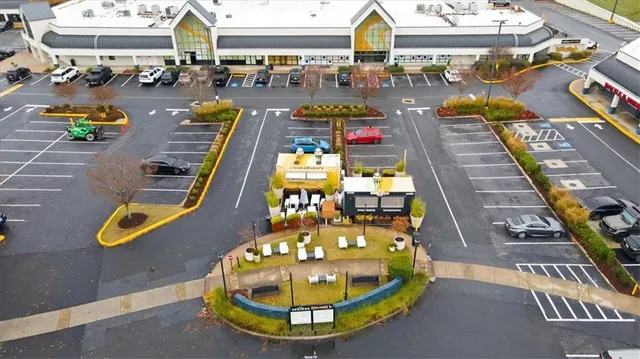 a view of a balcony with chairs and couches