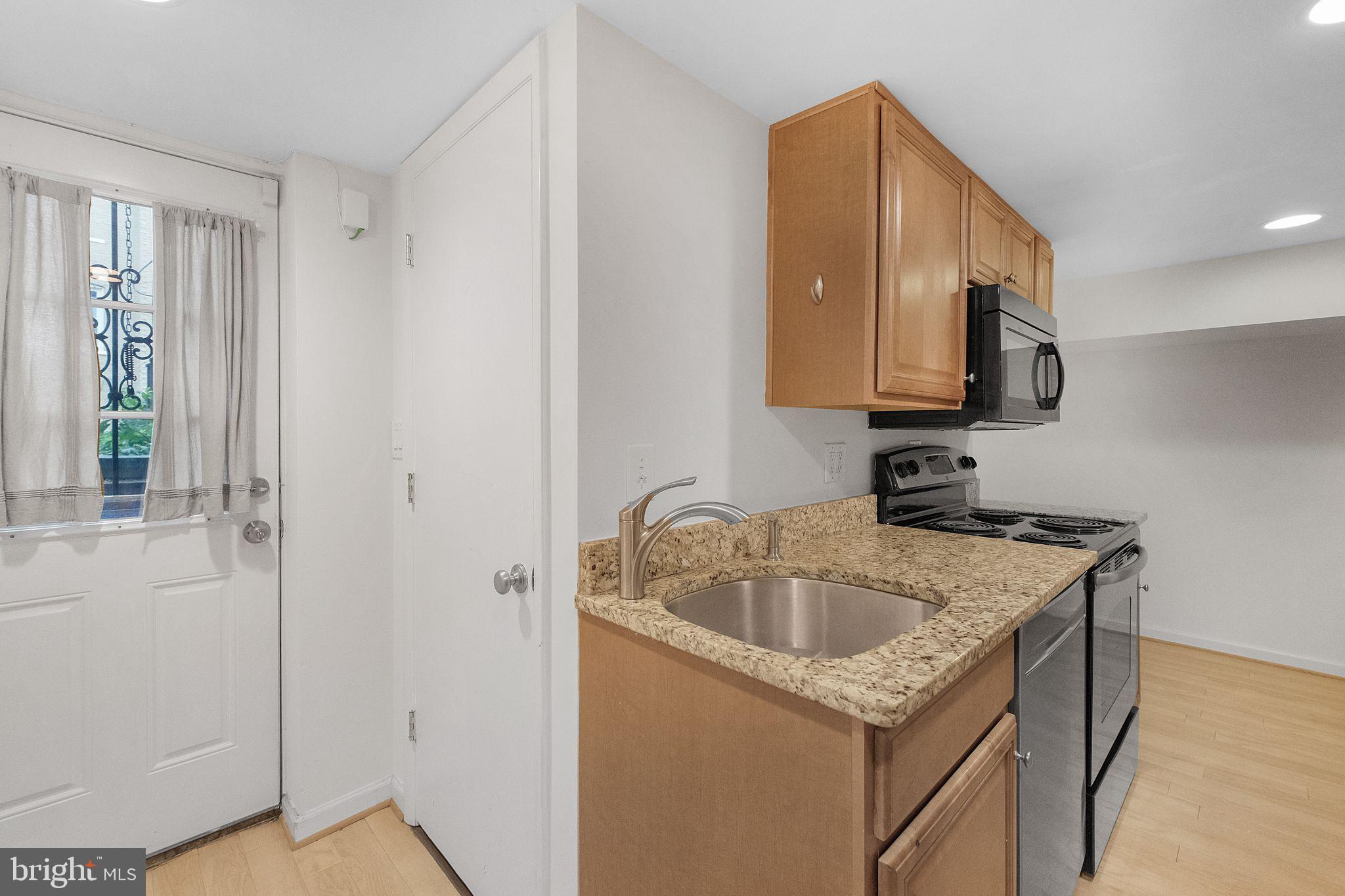 2803 North Capitol Street Northeast Washington, DC 20002 - Photo 33 of 37 Back Exit and Closet w/ Washer & Dryer