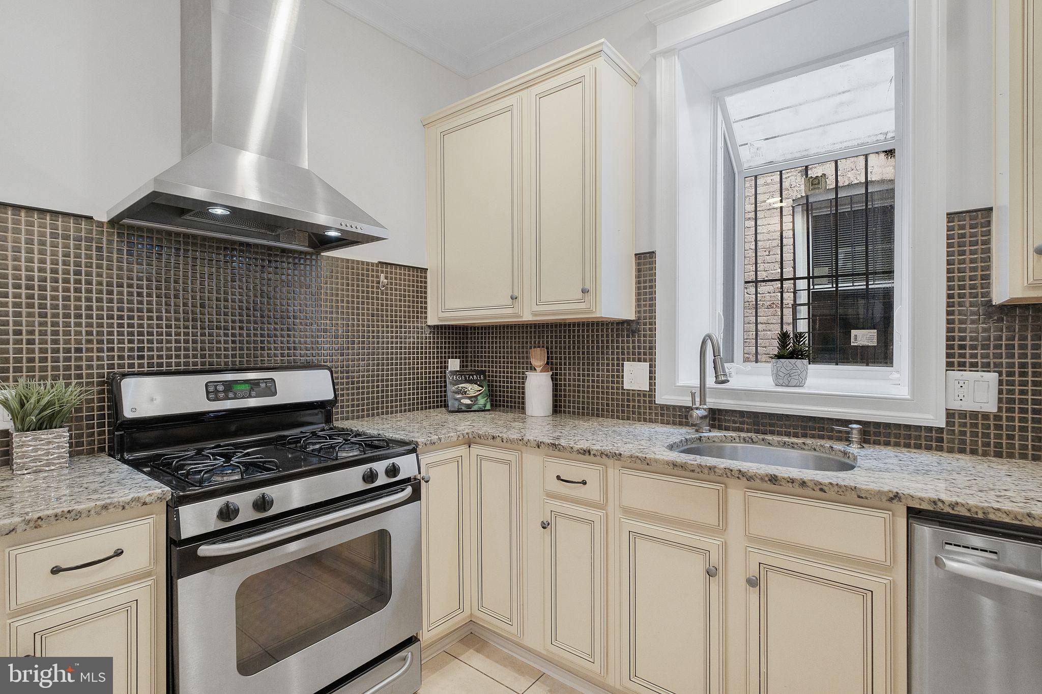 2803 North Capitol Street Northeast Washington, DC 20002 - Photo 4 of 37 Kitchen w/ Gas Stove & Stainless Steel Range Hood