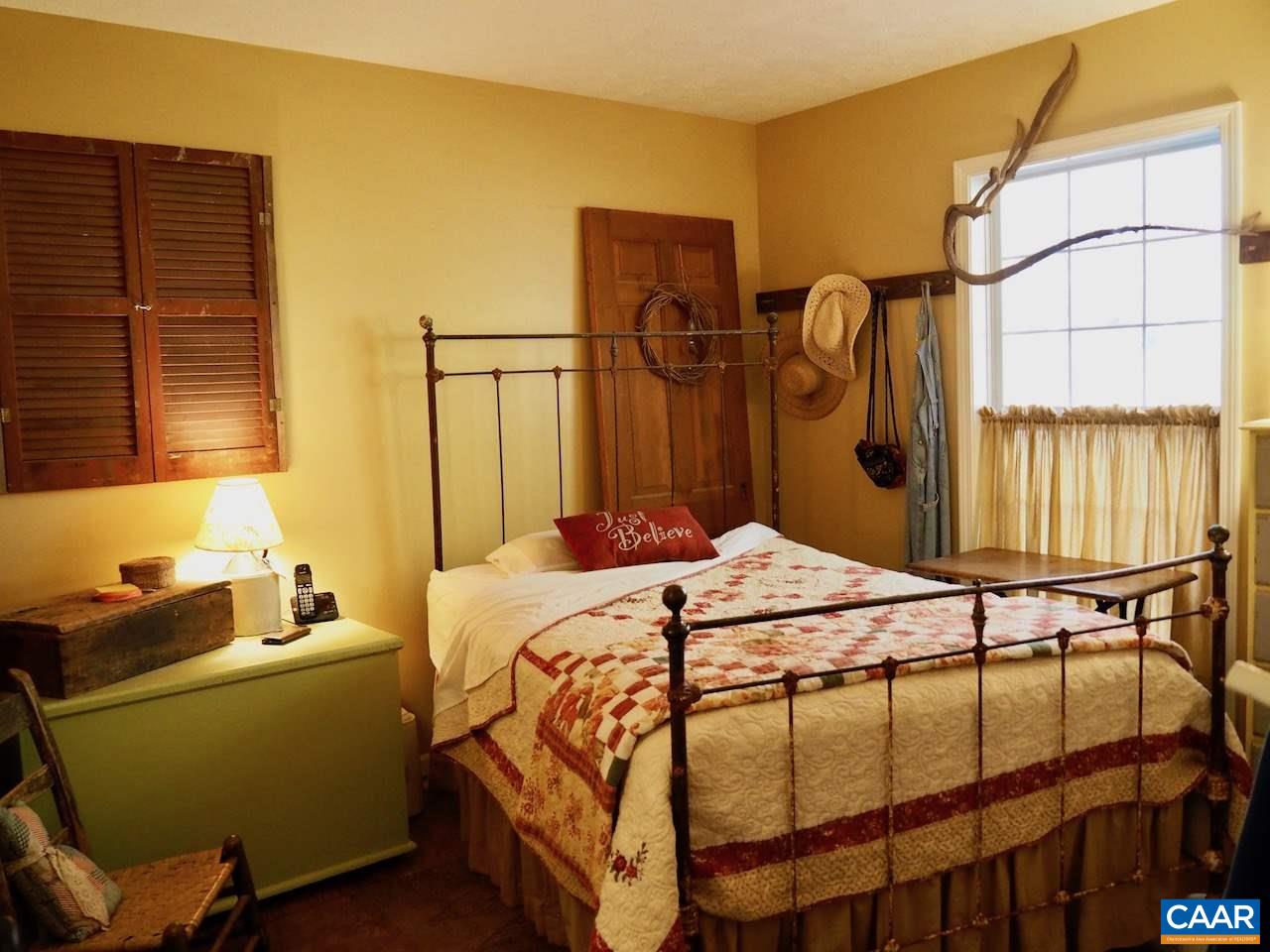 4346 Sharon Road Esmont, VA 22937 - Photo 11 of 17 a bedroom with a bed and a window