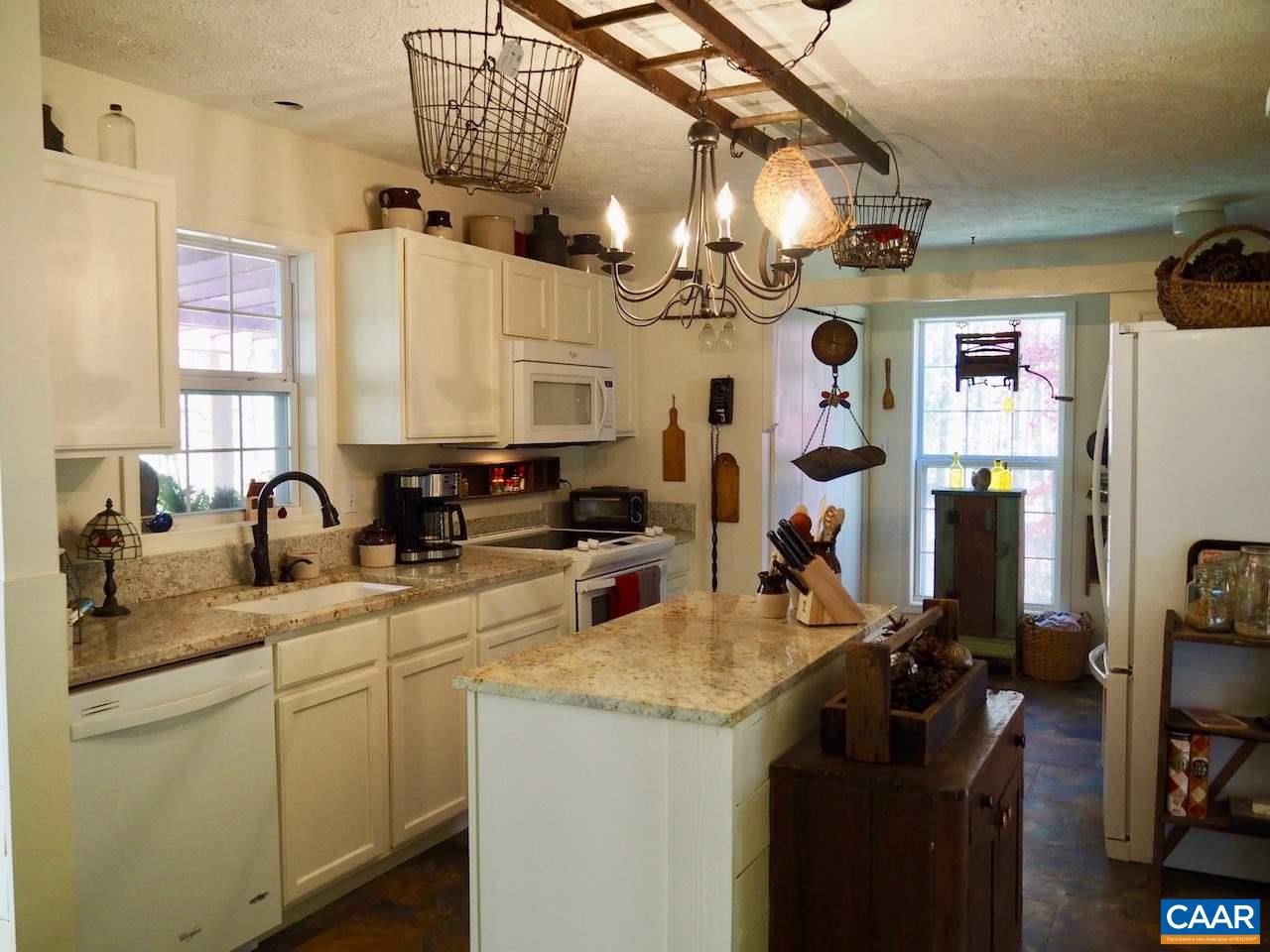 4346 Sharon Road Esmont, VA 22937 - Photo 4 of 17 a kitchen with a sink appliances and cabinets