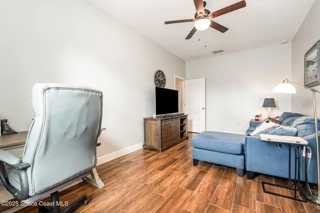 a room with furniture and a flat screen tv