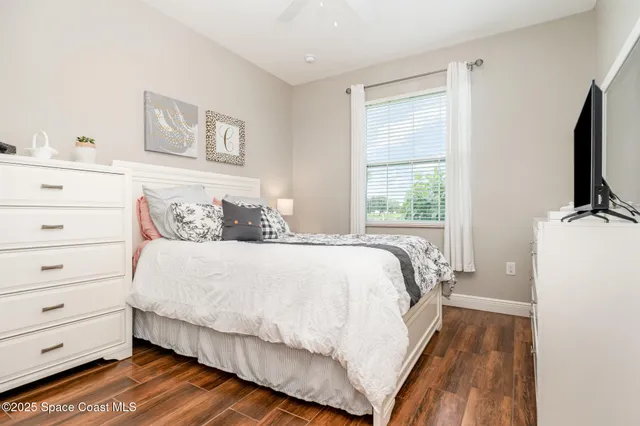 a bathroom with a granite countertop sink toilet and mirror