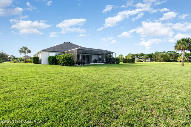a view of a lake with houses in the back