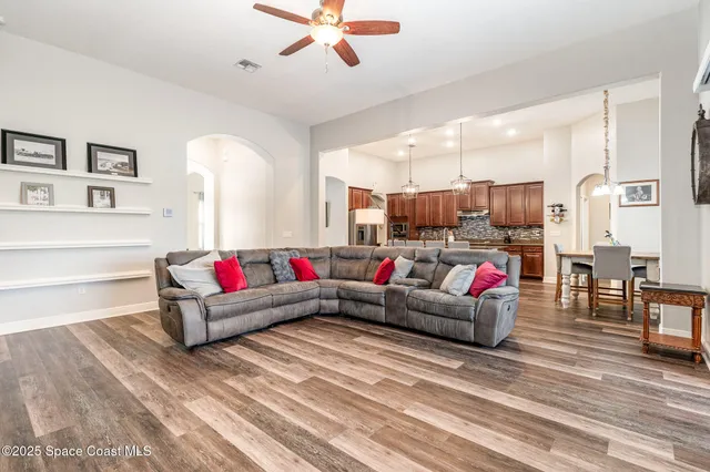 a view of a dining room with furniture and wooden floor
