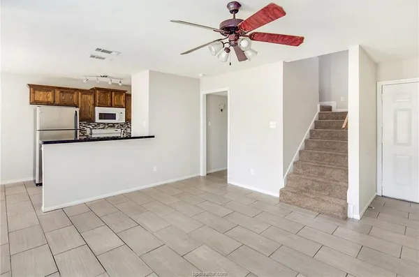 a view of a hallway view with staircase