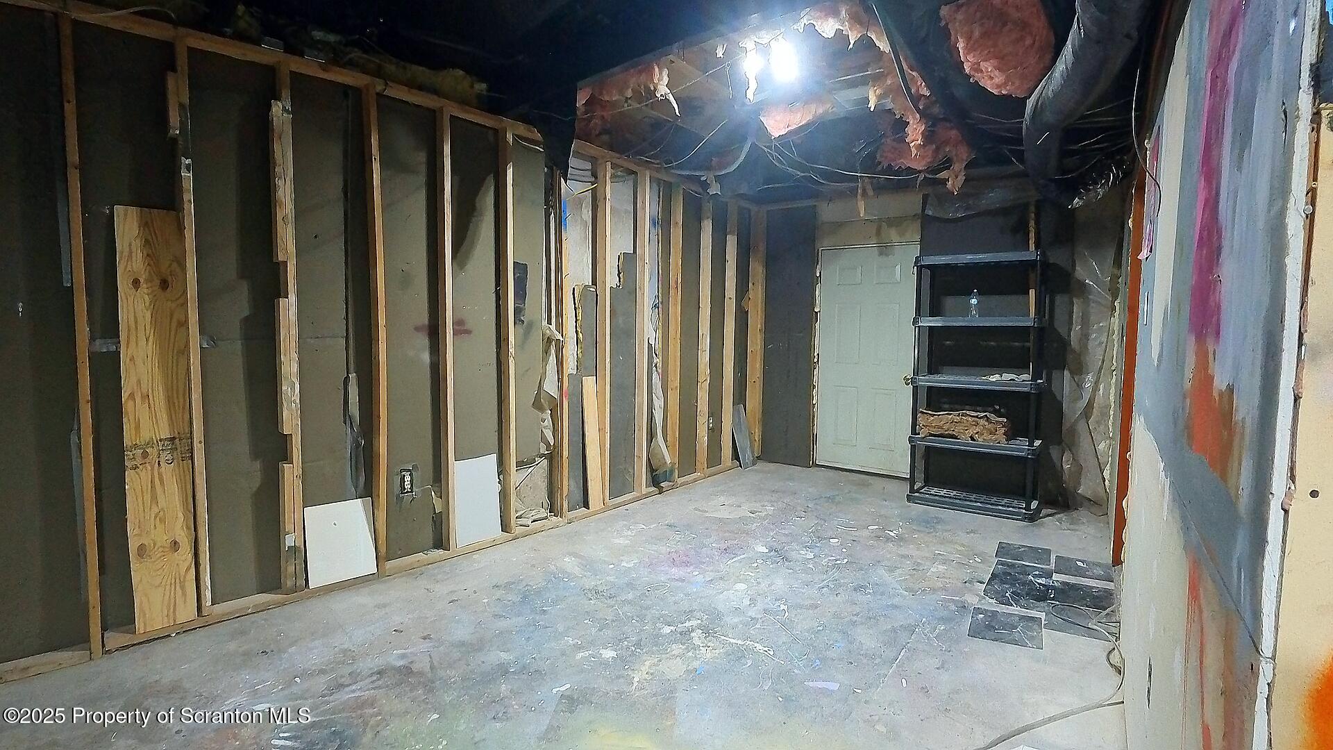 193 South Cedar Street Hazleton, PA 18201 - Photo 20 of 27 a view of empty room with a fireplace and a window