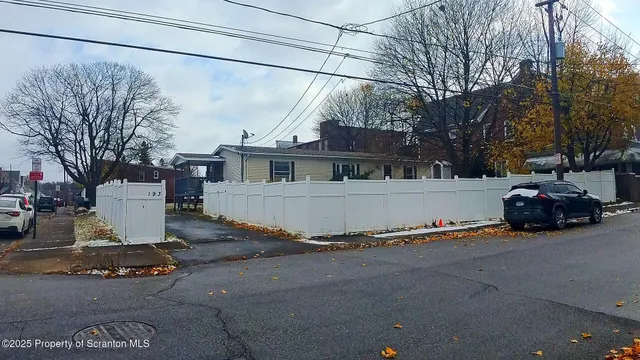 a view of a car park in front of house