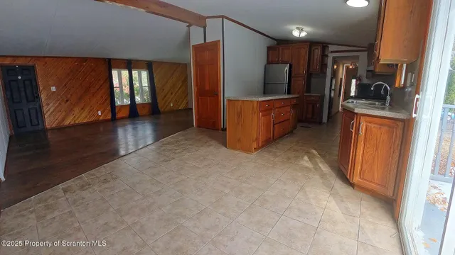a view of hallway with kitchen