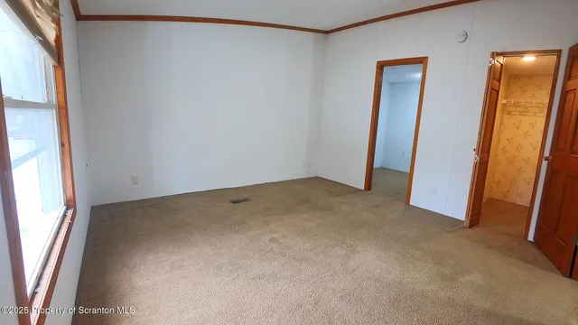 an empty room with a mirror