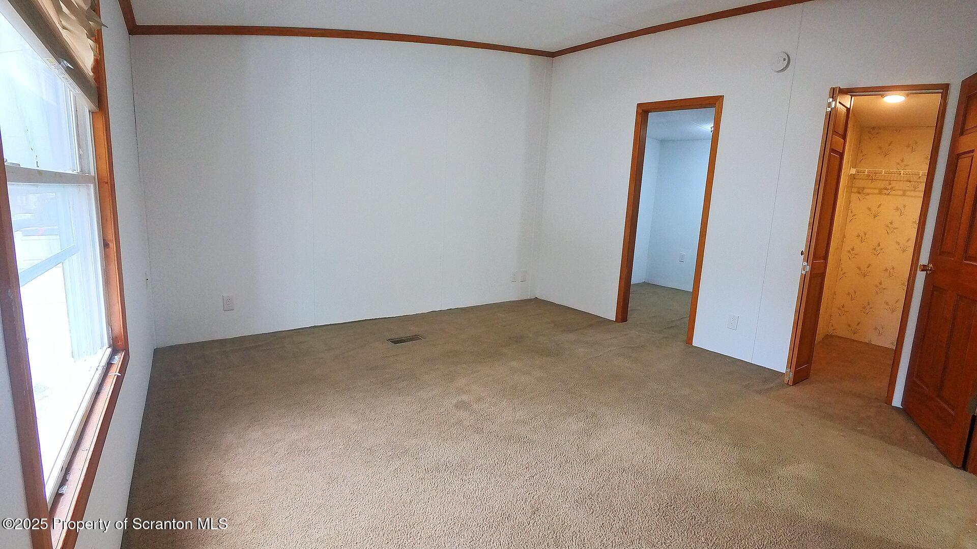 193 South Cedar Street Hazleton, PA 18201 - Photo 7 of 27 an empty room with a mirror
